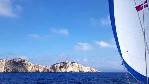 Iris-Diana_sailing_SW_Lefkada_lighthouse-9x16